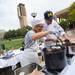 Residential Dinning Services employees Melissa and Buzz Cummings work together while canning salsa during a demo during the MFarmers' Market set up outside of the Duderstadt Center on Thursday. Melanie Maxwell I AnnArbor.com